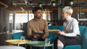 A woman and man talking and brainstorming